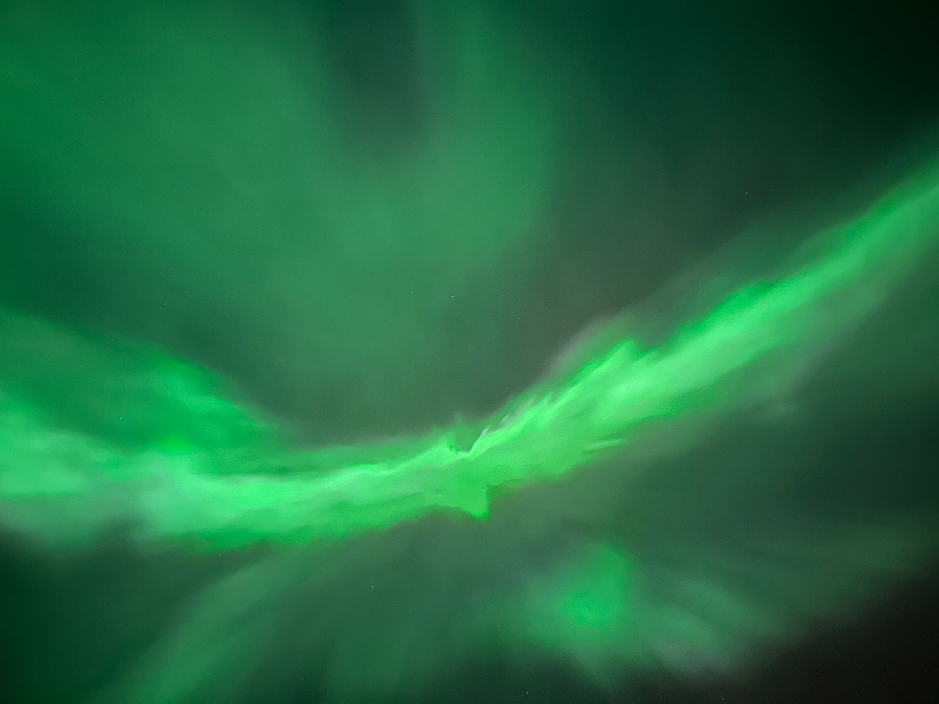 Close-up of vivid green aurora corona overhead in Drevsjø