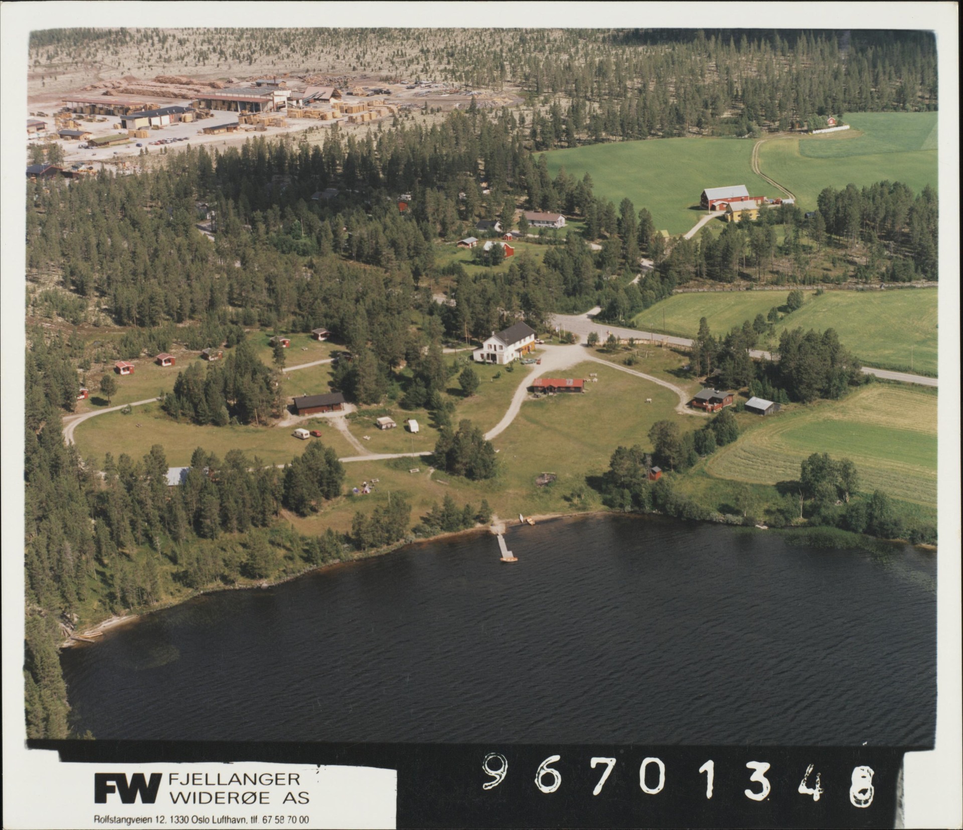 Aerial view from 1996 showing the tar kiln area across from the farm, now transformed into a camping site by the lake.